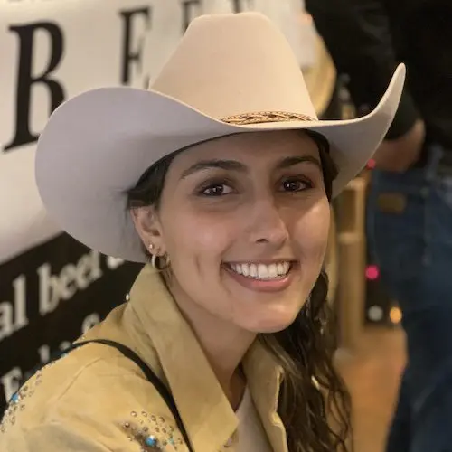 close up of woman wearing cowboy hat