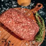 2 pounds of ground beef on cutting board