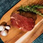 piece of tenderloin steak on cutting board